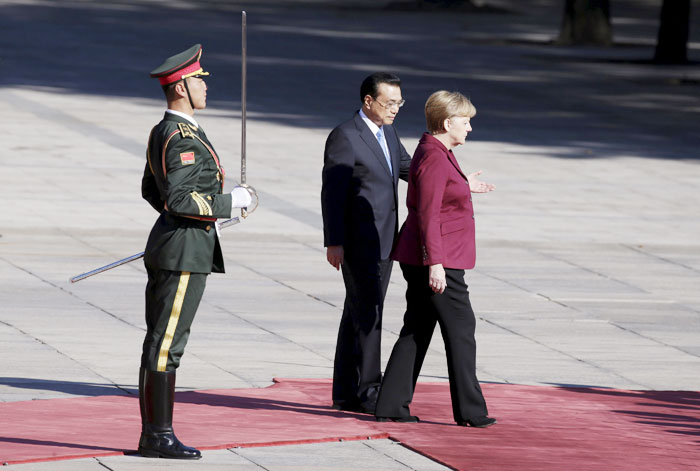 Merkel heads to China as trouble brews at home