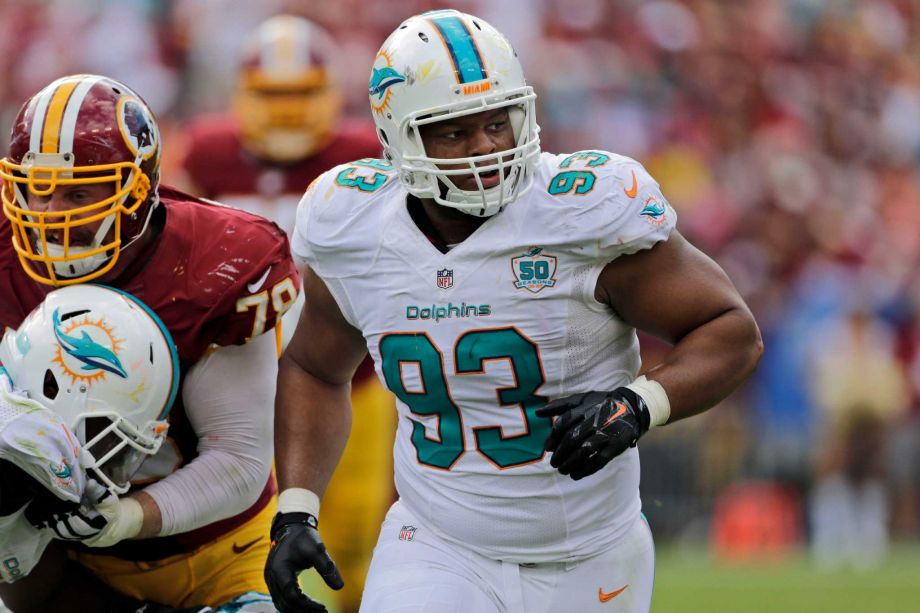 Miami Dolphins defensive tackle Ndamukong Suh rushes during the second half of an NFL football game against the Washington Redskins in Landover Md. Todd Bowles has figured out the key to slowing Nd