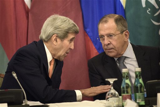 US Secretary of State John Kerry left and Russian Foreign Minister Sergey Lavrov share a word prior to the start of the Syria talks at a hotel in Vienna Austria Friday Oct. 30 2015. Kerry is acknowledging that progress will be difficult as he launch