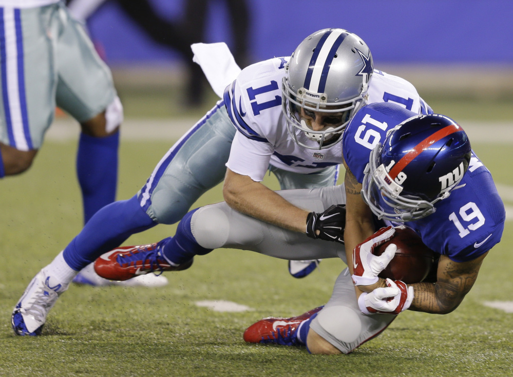 Myles White of the Giants recovers a fumble by Cole Beasley of the Cowboys on a punt return in the second half Sunday in East Rutherford New Jersey. The Giants won 27-20