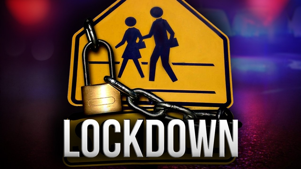 A driver called 911 after seeing a person with a gun just blocks away from the school Thursday morning