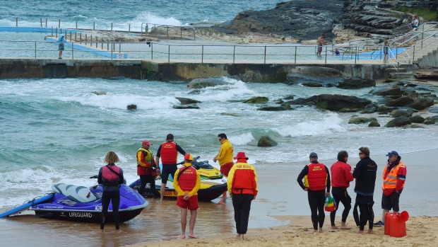 Surf Life savers and rescue prepare to enter the water in the search at Curl Curl Beach