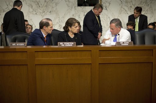 Senate Intelligence Committee Chairman Sen. Richard Burr R-N.C. right confers with committee Vice-Chair. Sen. Dianne Feinstein D-Calif. center and committee member Sen. Ron Wyden D-Ore. on Capitol Hill