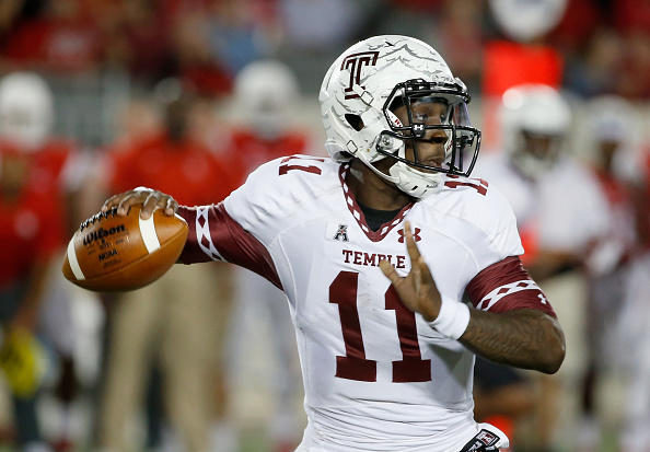 HOUSTON TX- OCTOBER 17 P.J. Walker #11 of the Temple Owls drops back to pass in the first half of their game against the Houston Cougars at TDECU Stadium