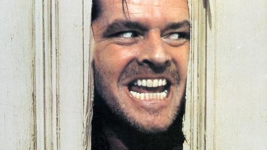 Jack Nicholson peering through the axed-in door in the film'The Shining' 1980