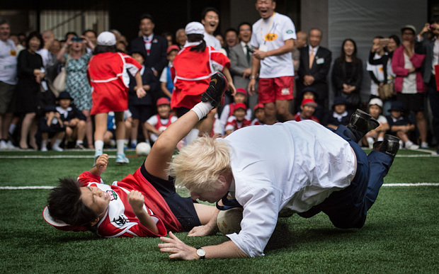 Mayor of London Boris Johnson joins a Street Rugby tournament in a Tokyo street with school children and adults from Nihonbashi Yaesu & Kyobashi Community Associations to mark Japan hosting 2019 Rugby World Cup where Mr Johnson is on the final day of