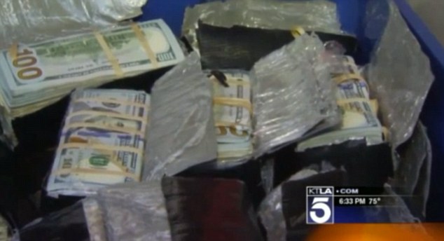 The money in $20 and $100 bills was discovered yesterday in the bin in the garden of the home in Fontana in California