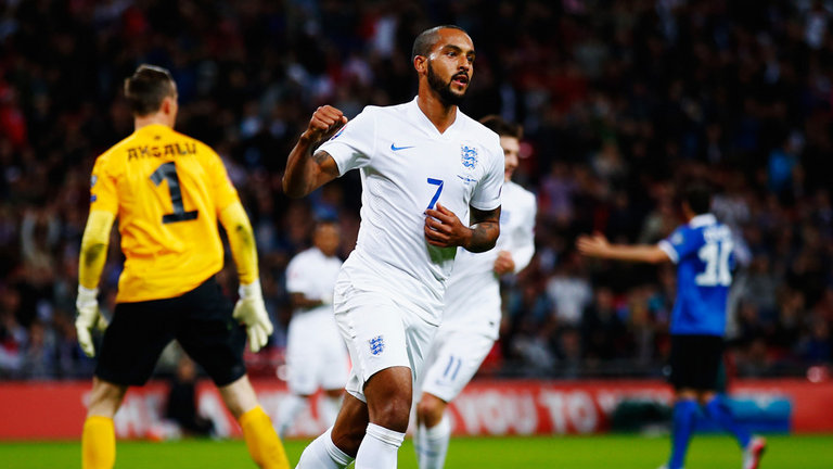 Theo Walcott of England celebrates scoring against Estonia