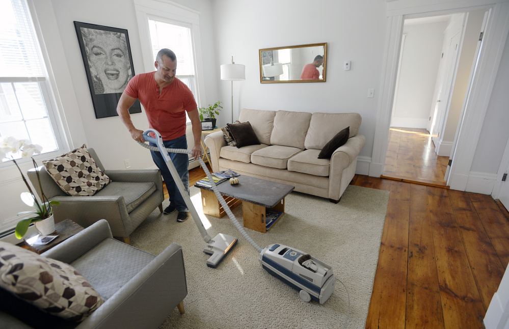 Gary Wagner vacuums the half of his home he rents out on Airbnb after guests had left Thursday. The West End homeowner started listing the space in July and says it quickly was booked through October. “There’s a clear demand,” he said