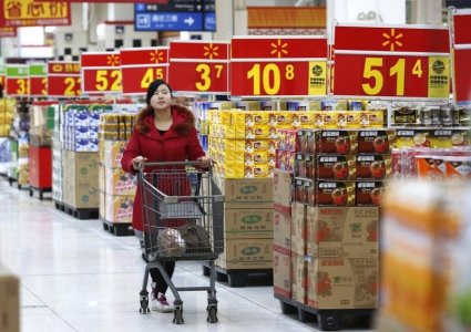 A customer shops at a Wal Mart store in Beijing