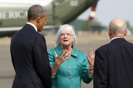 U.S. President Barack Obama is greeted by Eugene Mayor Kitty Piercy upon arrival in Oreg