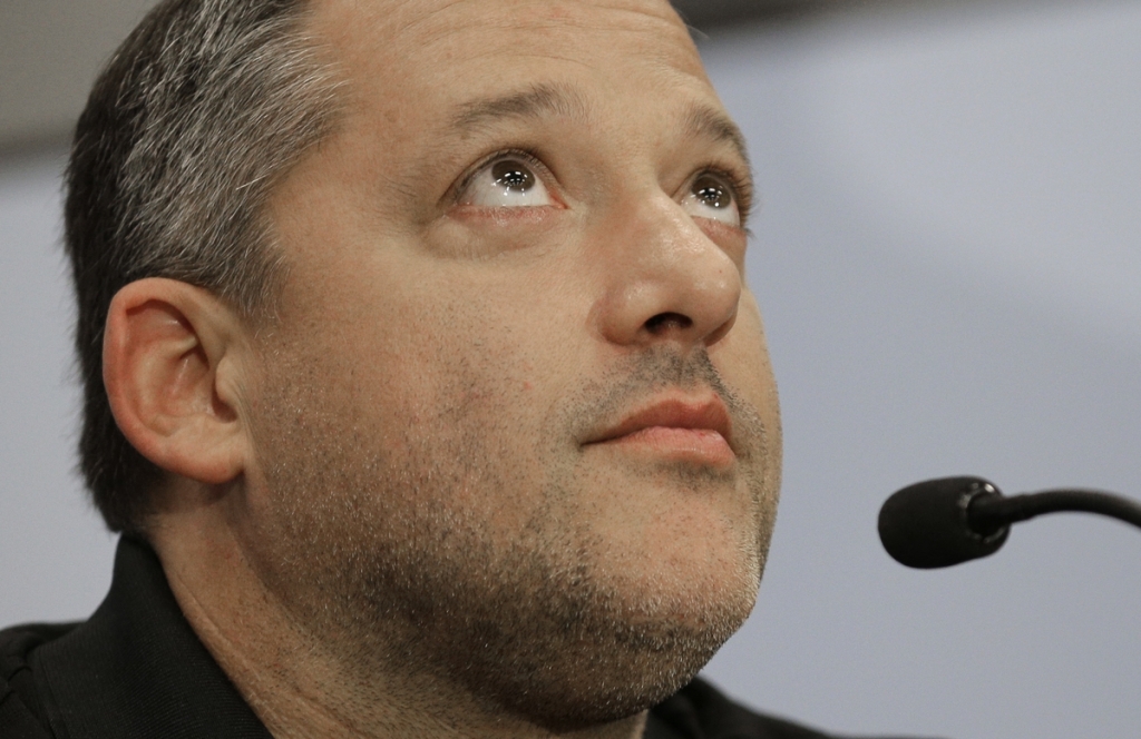 Tony Stewart listens to a question during a news conference Wednesday in which he announced his retirement from driving NASCAR Sprint Cup series racing after the 2016 season