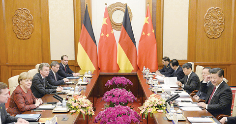 BEIJING German Chancellor Angela Merkel and Chinese President Xi Jinping attend a meeting at the Diaoyutai State Guesthouse in Beijing. —AP