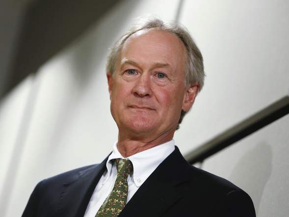 Former Rhode Island Governor Chafee waits to go onstage to announce he will seek the Democratic nomination to be U.S. president during an address to the GMU School of Policy Government and International Affairs in Arlington