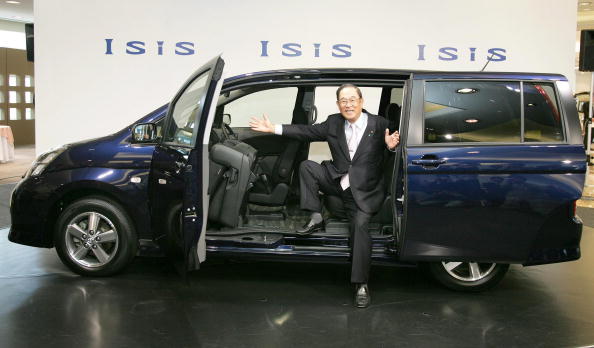 Toyota Motor Corporation President Fujio Cho introduces a new minivan Isis during a press preview at a Toyota show room in Tokyo 28 September 2004