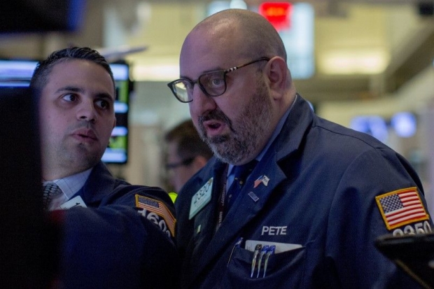 Traders work on the floor of the New York Stock Exchange