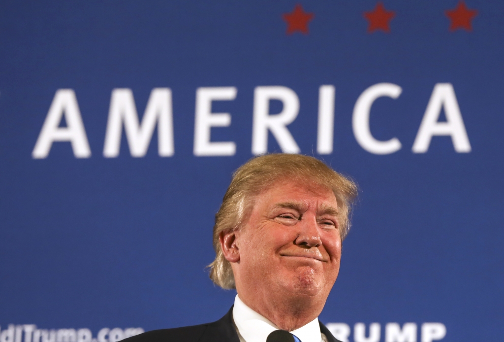 Republican presidential candidate Donald Trump smiles as he receives applause after speaking at a town hall meeting at a country club in Atkinson N.H. AP  Cheryl Senter