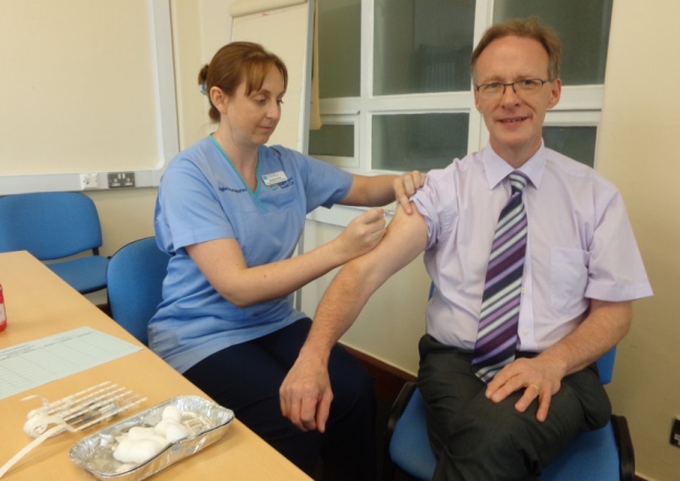 Dr Richard Wright gets flu vaccination