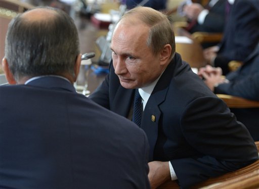 Russian President Vladimir Putin second right is seen Friday with several of his presidential aides at a meeting of the Commonwealth of Independent States an association of former Soviet republics