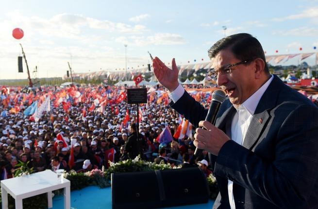 Turkish Prime Minister Ahmet Davutoglu addresses the crowd during a mass campaign rally by the ruling Justice and Development Party at Yenikapi in Istanbul