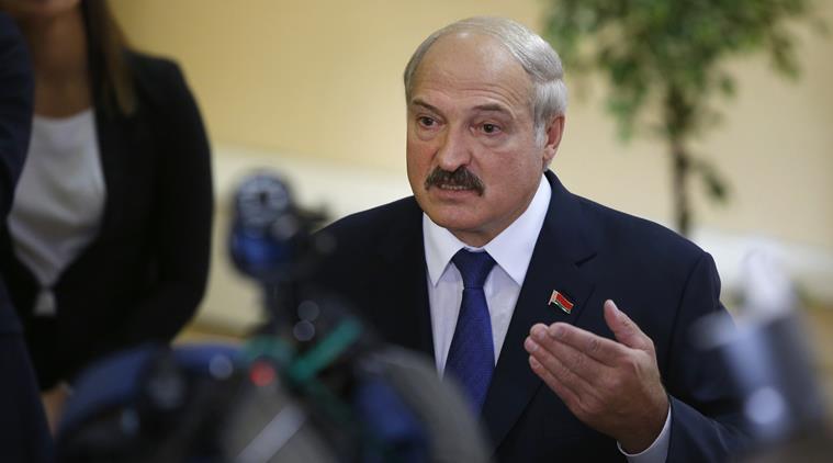 Belarusian President Alexander Lukashenko speaks to media at a polling station after voting during the presidential election in Minsk Belarus Sunday Oct. 11 2015. A presidential election was under way Sunday in Belarus where authoritarian leader Alex