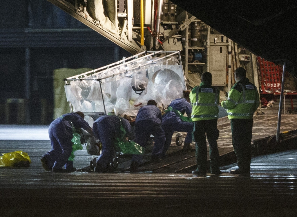 30 2014 shows medical personnel wheel a quarantine tent trolley containing Scottish healthcare worker Pauline Cafferkey who was diagnosed with Ebola after returning to Scotland from Sierra Leone into a Hercules T