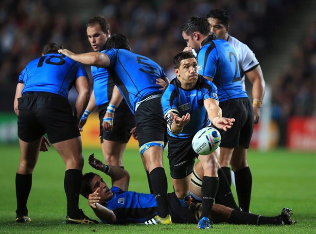 Uruguay's Agustin Ormaechea passes the ball during the Rugby World Cup match between Fiji and Uruguay at stadium:mk Milton Keynes England Tuesday Oct. 6 2015. UNITED KINGDOM OUT NO SALES NO ARCHIVE