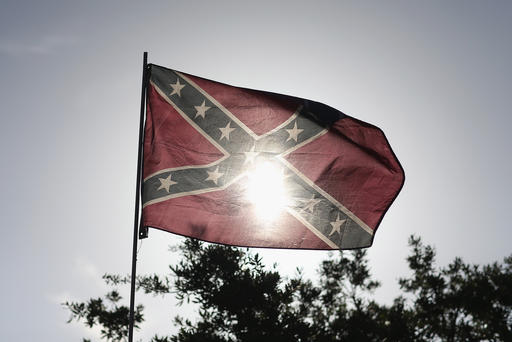 A Confederate flag is seen during a rally to show support for the American and Confederate flags