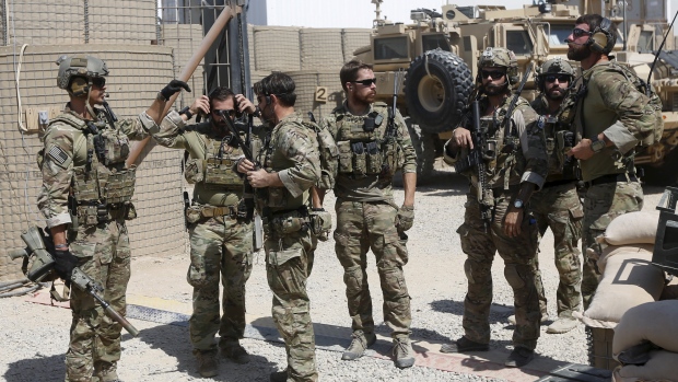 U.S. special forces soldiers talk to each other before they leave their base in Helmand Afghanistan in September 2015. The U.S. government plans to send special forces troops to northern Syria to work with local ground forces senior officials said Frid