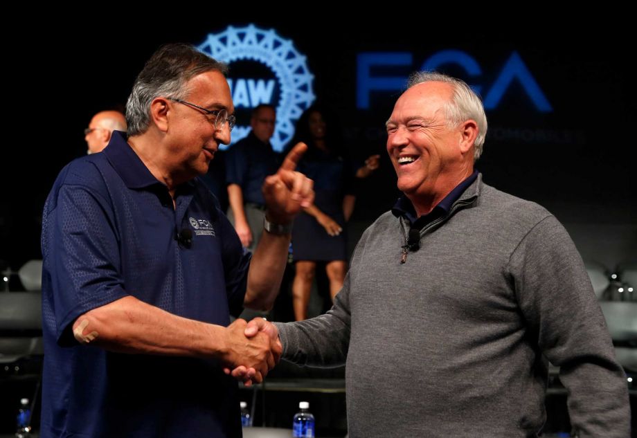 Fiat Chrysler Automobiles CEO Sergio Marchionne left and United Auto Workers President Dennis Williams were instrumental in the contract talks in Detroit. About 77 percent of the union members voted for the new four-year contract that includes raises