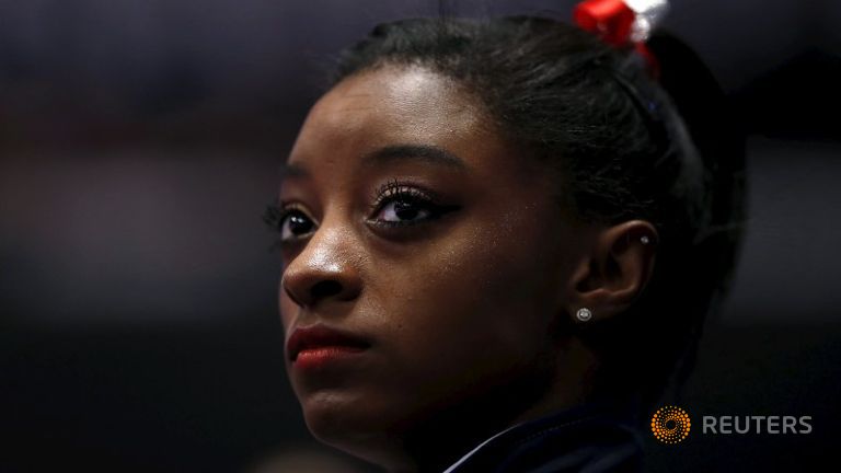 Biles leads US bid to defend team gymnastics title