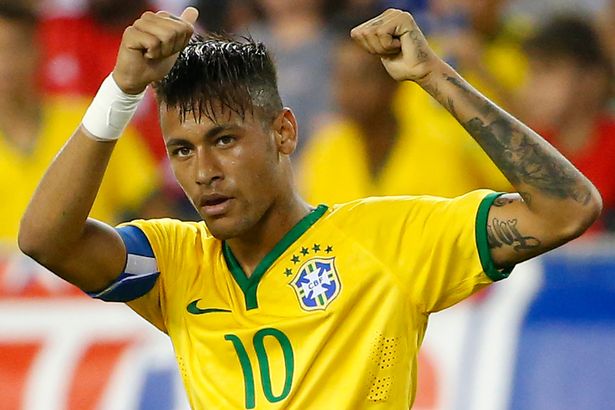 Neymar Jr. celebrates after he scored a penalty against USA