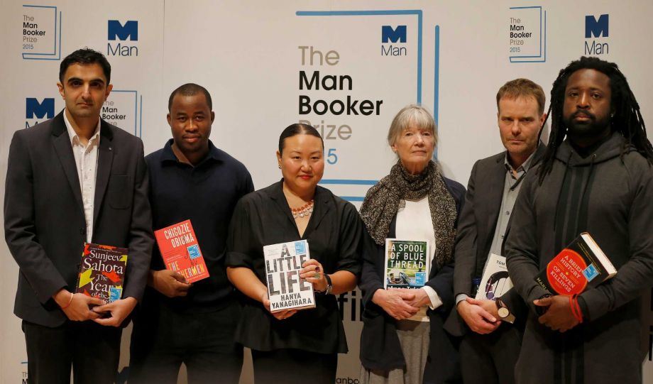 Authors nominated for the 2015 Man Booker Prize from left Sunjeev Sahota Chigozie Obioma Hanya Yanagihara Anne Tyler Tom Mc Carthy and Marlon James pose with their books on stage at the Royal Festival Hall in London Monday Oct. 12 2015. The six