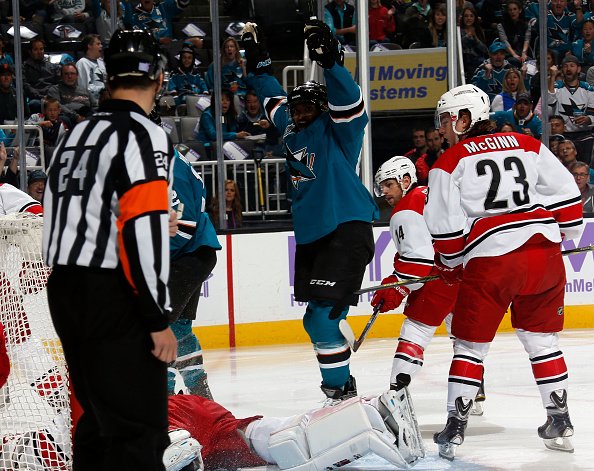 SAN JOSE CA- OCTOBER 24 Joel Ward #42 of the San Jose Sharks celebrates after scoring the first goal of the game against Brock Mc Ginn #23 Nathan G