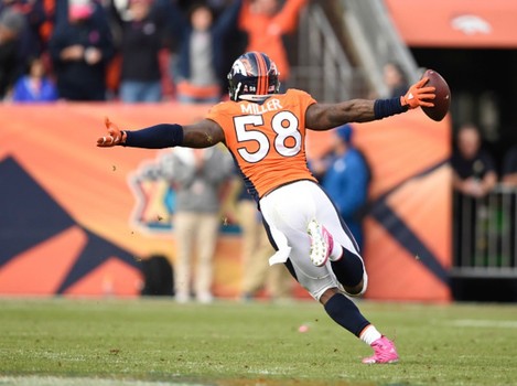 Von Miller of the Denver Broncos celebrates his fumble recovery to end the game. The Denver Broncos played the Minnesota Vikings at Sports Authority Field at Mile High in Denver CO