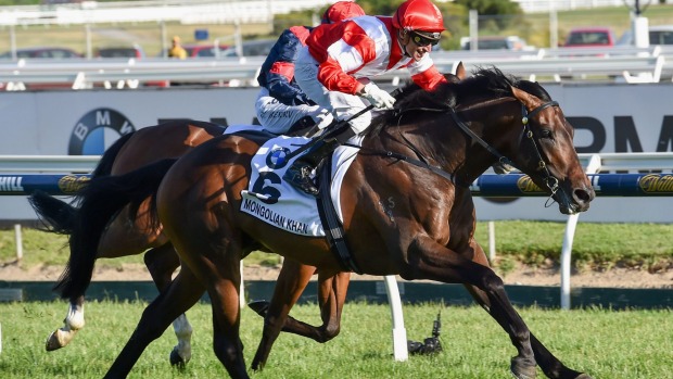 Opie Bosson rides Mongolian Khan to victory in the Caulfield Cup on Saturday