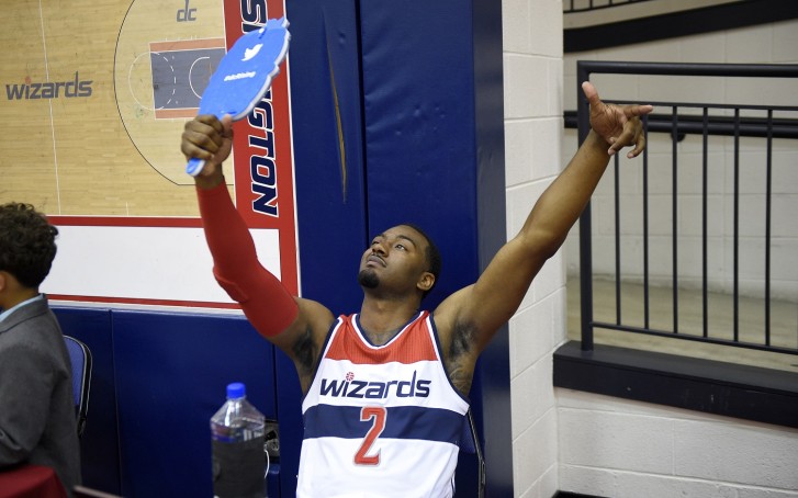 Washington Wizards John Wall uses a Twitter mirror during an NBA basketball media day Monday Sept. 28 2015 in Washington