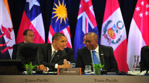 President Barack Obama speaks to U.S. Trade Representative Ron Kirk during a meeting with Trans Pacific Partnership leaders at the Asia Pacific Economic Cooperation summit in Honolulu in 2011