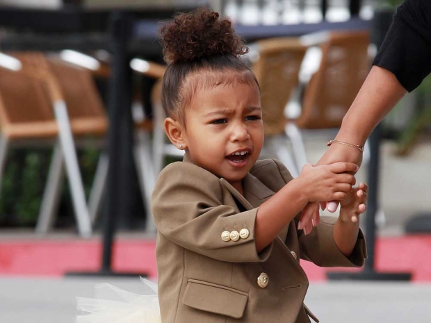 North West is a cheeky little ballerina in adorable tutu as she heads to a