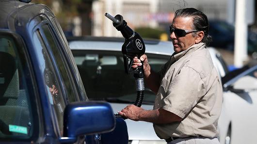 A customer prepares to pump gasoline at an Arco gas station in Mill Valley California