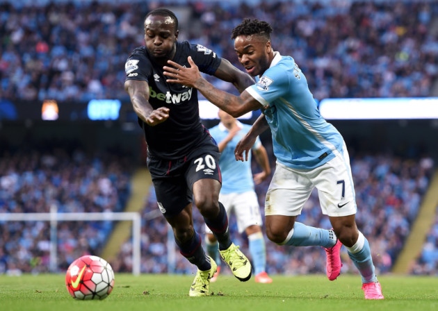 West Ham goalscorer Victor Moses holds off Manchester City