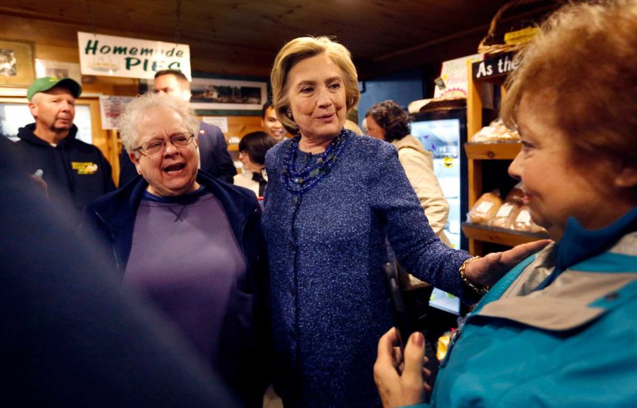 Democratic presidential candidate Hillary Rodham Clinton center meets with customers during a campaign stop at the Moulton Farm Wednesday Oct. 28 2015 in Meredith N.H