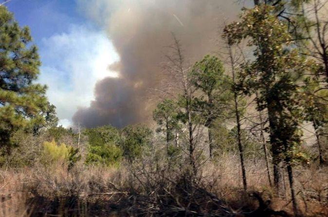 Wildfire burning between Bueschner and Bastrop State Parks