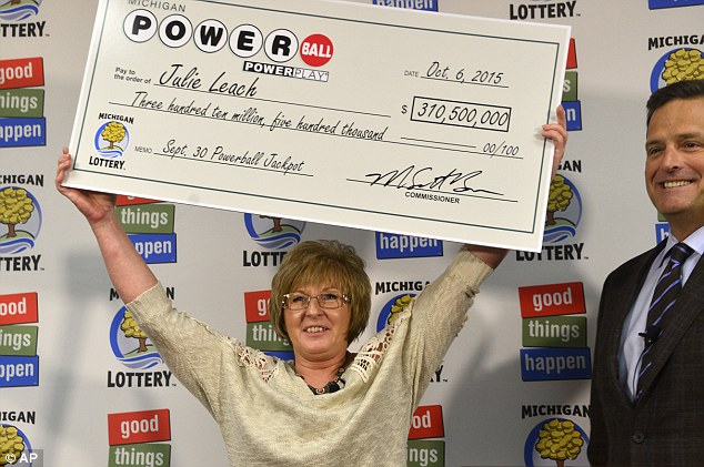 Julie Leach said she has quit her'nasty dirty job at a Michigan fiberglass factory and now plans to build homes for herself her partner and their three children after winning the $310.5million Powerball jackpot