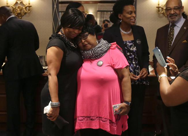 Plaintiffs Lisa Johnson left hugs Deborah Neal before a news conference announcing the filing a lawsuit over their ejection from a Napa Valley Wine Train Thursday Oct. 1 2015 in San Francisco