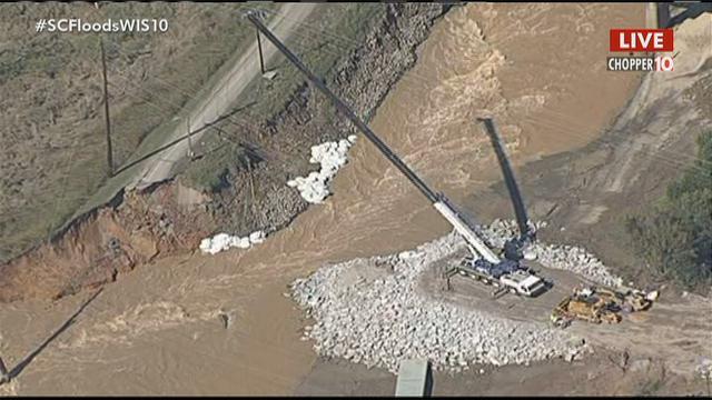 Work continues on the temporary dam