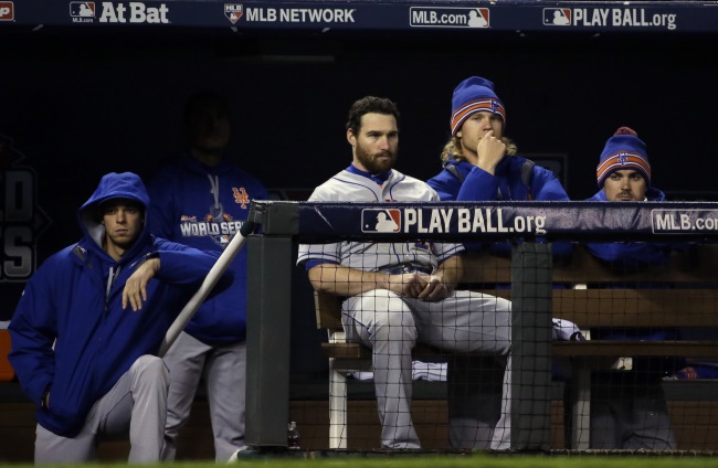 Some New York Mets watch from the dugout during the eighth inning of Game 2 of the Major League Baseball World Series against the Kansas City Royals Wednesday Oct. 28 2015 in Kansas City Mo