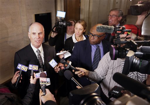 Patrick Dunphy an attorney for two Milwaukee police officers who were shot and seriously wounded by a gun purchased at a Wisconsin gun store speaks to the media after jurors ordered the gun store to pay nearly $6 million in damages Tuesday Oct. 13 20