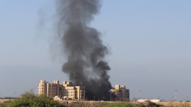 Smoke rises following an explosion Tuesday that hit Hotel al Qasr where Cabinet members and other government officials are staying in the southern port city of Aden Yemen