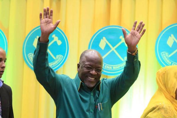 Tanzania's Works Minister John Magufuli salutes delegates after the ruling party Chama Cha Mapinduzi elected him as the presidential candidate for the October 25 election in the capital Dodoma